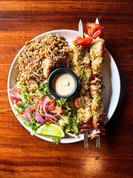 Jaffa grilled fish skewers, rice and colorful salad